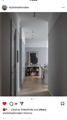 an instagramted photo of a hallway leading to a dining room and kitchen area