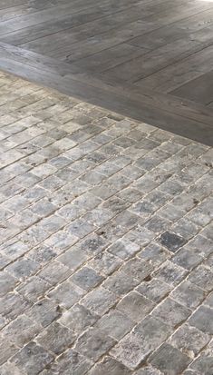 a person riding a skateboard on a brick walkway