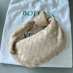 Bottega Veneta Mini Jodie Porridge In Excellent Condition, Like New. I Have Used It Only Twice But I Am Listing It Because I No Longer Use It. Material: 100% Lambskin Lining: Calfskin Color: Porridge Hardware: Gold Finish Height: 23 Cm | 9.1" Width: 28 Cm | 11" Depth: 8 Cm | 3.1" Handle Drop: 10 Cm | 3.9" Made In: Italy Mini Jodie, Bottega Veneta Bags, Bottega Veneta, Gold Finish, Mini Bag, Calf Skin, In Italy, Bag Lady, Like New