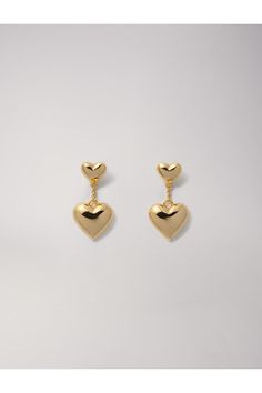 Heart earrings    With the release of the new collection, the studio has created iconic jewellery with a bold and sophisticated tone to elevate any outfit. Embody timeless elegance with these pendant earrings in gold-plated recycled brass. These earrings feature two hea   With the release of the new collection, the studio has created iconic jewellery with a bold and sophisticated tone to elevate any outfit. Embody timeless elegance with these pendant earrings in gold-plated recycled brass. These Chic Heart Drop Earrings For Anniversary, Chic Heart Shaped Drop Earrings For Anniversary, Chic Anniversary Heart Drop Earrings, Gold Plated Earrings For Valentine's Day Formal, Gold Plated Earrings For Valentine's Day Formal Occasions, Gold-plated Drop Earrings With Heart Charm, Gold Plated Drop Earrings With Heart Charm, Gold Dangle Heart Earrings For Formal Events, Classic Gold Double Heart Earrings