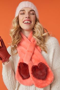 If you want something extra special, then look no further. This orange scarf with heart emblem is made of the finest quality faux fur and is sure to add a glamorous touch to any outfit.  15% Acrylic 85% Modacrylic Fur Pom Pom Beanie, Faux Fur Scarf, Faux Fur Bag, Fur Gloves, Pom Pom Beanie Hat, Fur Headband, Orange Scarf, Faux Fur Scarves, Faux Fur Hat