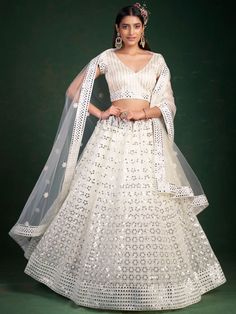 <ul>
<li style="text-align: justify;">Steal the show adoring this luxury white color lehenga crafted with georgette material finished with sequin work, paper mirror work, thread embroidery, and paper mirror work.</li>
<li style="text-align: justify;">This white lehenga arrives with a similar color choli made with georgette material designed with thread embroidery and paper mirror work. It also arrives with a similar color soft net material dupatta completed with lace bord White Color Lehenga, Lehenga White, White Lehenga Choli, Plus Size Lehenga, White Lehenga, Georgette Lehenga, Party Wear Lehenga Choli, Choli Designs, Lehenga Choli Online