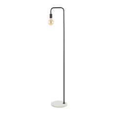 a black and white floor lamp with a light bulb on it