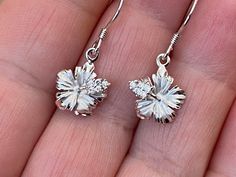 "Solid .925 Sterling Silver Hawaiian Hibiscus Flower Earrings. Purposely small & dainty at 8MM (just about 1/4\"). --They have a matte center w/ high-polished edges and accents. They also have tiny CZ's in the stem. The High-polished Sterling finish is stunning, durable and nickel-free. Lots of sparkle makes this a popular design in our Hawaii stores. --The Hibiscus is Hawaii's official State Flower. Hawaiian Hibiscus shrubs bear blooms almost every day but the blossoms last for only a day o Sterling Silver Flower Earrings Fine Jewelry, Hypoallergenic White Gold Flower-shaped Jewelry, Silver Flower Cluster Earrings In Sterling Silver, Pierced White Gold Flower Earrings, Sterling Silver Flower-shaped Jewelry With Matching Earrings, Silver Sterling Silver Flower Cluster Earrings, White Gold Flower Shaped Pierced Earrings, Sterling Silver Cluster Earrings With Flower Shape As Gift, White Gold Flower-shaped Pierced Earrings