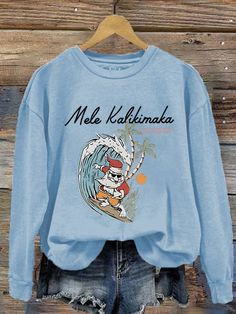 Women's Hawaiian Christmas Mele Kalikimaka Print Crew Neck Sweatshirt Casual Graphic Print Holiday Sweatshirt, Casual Graphic Print Sweatshirt For Holiday, Casual Holiday Sweatshirt With Graphic Print, Casual Christmas Sweatshirt With Cartoon Print, Casual Letter Print Tops For Holiday, Holiday Crew Neck Top With Cartoon Print, Hawaiian Christmas, Mele Kalikimaka, The Picture