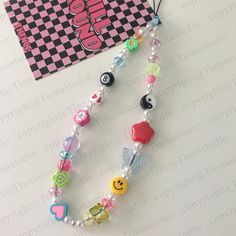 - This Trendy Y2K Phone Charm features high-quality mixed funky colorful beads and is a cute accessory for your phone, key, bag, USB, Switch, camera, or Airpods. It's also a cute gift for anyone who is looking for a last-minute gift ( we ship the next day), and a great party favors choice as well.  - Handmade with high-quality materials, this cute phone charm will match your phone case perfectly and add a touch of style to your look. It looks chic and elegant while taking a selfie. * MATERIAL: Acrylic * COLOR: Mixed * WEIGHT: Approximately 22g (0.78oz) If you would like to make the customized request, NO PROBLEM!    Just fill out the personalization option before you complete your purchase. It can be customized with your favorite words or name! Add this accessory to your collection today a Cute Multicolor Beaded Necklace With Beaded Chain, Trendy Yellow Beaded Necklaces, Cute Multicolor Beaded Necklaces For Parties, Trendy Pink Beaded Necklaces, Trendy Beaded Necklace For Birthday, Cute Multicolor Beaded Necklaces, Etsy Phone Charm, Y2k Phone Strap, Phone Charms Colorful