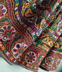 an image of a colorful cloth with many designs on it's edges and sides