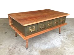 a wooden table with drawers on it