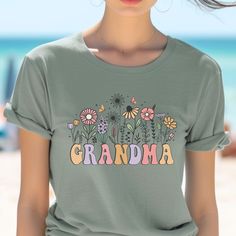 Grandma Floral Shirt, Grandma Wildflowers Shirt, Grandma T-Shirt, Grandma Mothers Day Gift, Gift for Grandma, Grandmother Gift SIZING: These classic Bella + Canvas unisex jersey short sleeve t-shirts run true to size, but for a roomy fit, please order one size up. For an oversized fit, order at least two sizes up. See sizing chart in photos) FEATURES: - 100% Airlume combed and ringspun cotton (fiber content may vary for different colors) - Direct-to-garment (DTG) long-lasting quality print - not Grandma Mothers Day Gift, Grandmas Mothers Day Gifts, Grandmother Gifts, Gift For Grandma, Grandma Gifts, Floral Shirt, Sizing Chart, Cotton Fiber, San Jose