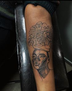 a woman's arm with a tattoo on it that has an image of a man in a turban