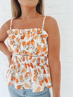 Turn heads and make a statement in this Southern Bell Smocked Top! This sassy yet fun peachy top features a smocked front, an open back, and matching bottoms. Perfect for those hot summer days - or your next vacay. Details: Length: 21" Bust: 32" Materials: SELF : 97% COTTON 3% SPANLINING : 100%COTTON Summer Tops With Elastic Waistband For Day Out, Summer Cotton Smocked Top With Smocked Back, Cotton Smocked Top With Smocked Back For Summer, Summer Floral Print Smocked Top For Brunch, Summer Tops With Elastic Waistband, Cotton Smocked Summer Top For Day Out, Spring Cotton Smocked Top With Elastic Waistband, Summer Vacation Top With Elastic Waistband, Summer Vacation Tops With Elastic Waistband