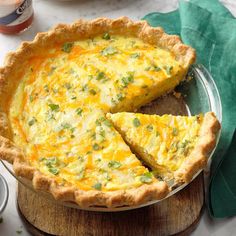 a quiche pie with one slice missing from it