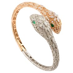 This Statement Diamond Serpentine Open Bracelet in 18K gold showcases sparkling natural emerald, weighing 0.27 carats and diamonds weighing 4.44 carats. It measures 25.85 mm long in length. Diamond brings love, fame, success and prosperity. Designed with diamond studded all over the serpentine bracelet, with emerald studded in the eyes of it to make you stand out on any occasion or event. The statement style of the bracelet complements the attire beautifully and this is a perfect Unique Gift, Br Serpentine Bracelet, Open Bracelet, Modern Bracelets, Mother Daughter Gifts, Snake Jewelry, Secret Santa Gift, Gift For Sister, Grandma Gift, Thanksgiving Gift