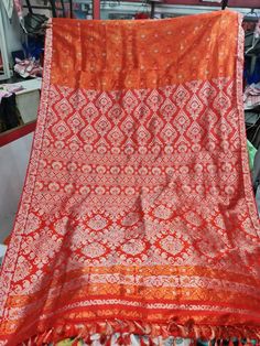 Experience the luxurious elegance of Assam silk with our handcrafted mekhela chadors. Each piece is carefully crafted using only the finest silk from the Assam region in India, known for its softness and durability. The intricate designs and traditional motifs make these mekhela chadors perfect for any special occasion, or simply as a statement piece in your wardrobe. Perfect for a modern women who want to keep her traditional roots alive. Each chador is unique and made with love, so you can be Semi-stitched Orange Banarasi Silk Lehenga, Orange Semi-stitched Banarasi Silk Lehenga, Orange Blouse Piece For Puja During Navratri, Orange Banarasi Silk Lehenga With Zari Work, Festival Orange Banarasi Silk Lehenga, Semi-stitched Silk Orange Lehenga, Orange Banarasi Silk Lehenga For Festivals, Orange Silk Semi-stitched Lehenga, Semi-stitched Orange Dola Silk Dupatta