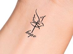 a woman's arm with a tattoo on it that says hope and a bird