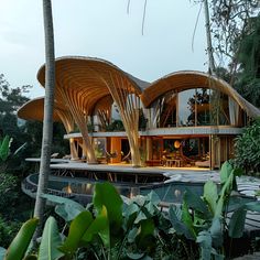 a house that is surrounded by trees and plants