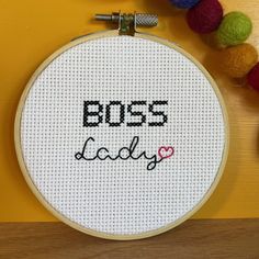 a cross stitch pattern with the words boss lady on it