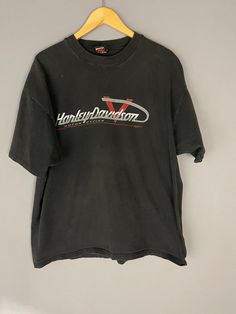 "Vintage Harley Davidson motorcycle T-shirt, 80's mens biker shirt, Chattanooga Tennessee YEAR: 1988 TAG SIZE:XXL MATERIAL: cotton MEASUREMENTS LAYING FLAT in INCHES: SHOULDER TO SHOULDER: 24\" ARMPIT TO ARMPIT: 25\" LENGTH TO WAISTLINE: 26\" # 309-A ALL T-SHIRTS IN MY SHOP ARE TRUE GENUINE VINTAGE, NOT REPRINTS!" Vintage Short Sleeve T-shirt For Motorcycling, Casual Cotton Shirt For Biker Events, Biker Style Crew Neck Top With Logo Print, Casual Short Sleeve Shirt For Biker Events, Casual Short Sleeve Top For Biker Events, Biker Style Crew Neck Shirt For Streetwear, Vintage Black Shirt For Fans, Grunge Crew Neck Tops For Biker Events, Letter Print Crew Neck Tops For Biker Events