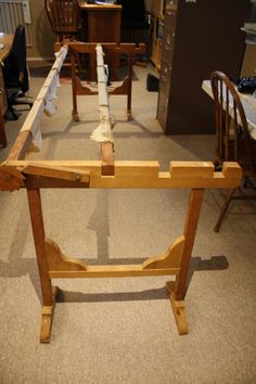 a wooden table sitting in the middle of a room