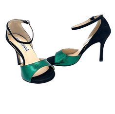 This stylish, dual-toned Penny shoe lends an air of exclusivity for any occasion. The exquisite combination of deep black suede and striking green leather creates a classic look, while the luxurious comfort makes them a pleasure to wear. Perfect for any stylish tanguera looking to express their sophistication and refinement. Green Heels With Deep Heel Cup For Formal Occasions, Elegant Green Suede Heels, Elegant Green Leather Heels, Green Heels With Leather Sole For Party, Green Ankle Strap Heels For Gala, Classic Green Heels For Formal Occasions, Elegant Green Heels With Contrasting Heel Counter, Elegant Green Heels With Removable Insole, Green Heels For Gala