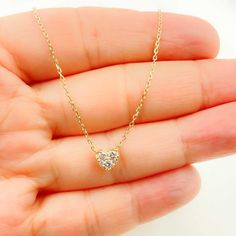 14K Solid Gold Necklace With Heart in the Center Available in 16 inches HIGH QUALITY DIAMOND NECKLACE This modern and on-trend design is crafted from genuine 14k solid gold Item number: MC131 Heart Size: 5x6mm Diamond Weight: 0.2 CTS Diamond Clarity: VS2 Metal: 14k Solid Gold Purity: 14K (Stamped for Authenticity) Processing time: 1-2 business days FAST SHIPPING - Gold Jewelry Store NY sells only authentic solid 14K Gold. - We do not sell gold plated or gold-filled jewelry. - This is a very deli Diamond Heart Necklace, Mini Necklace, Gold Jewelry Stores, Heart Necklace Diamond, Solid Gold Necklace, Tiny Diamond, Handmade Beaded Jewelry, Sell Gold, Jewelry Business