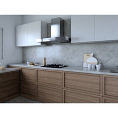 an image of a kitchen setting with white and wood accents on the countertops, cabinets and drawers