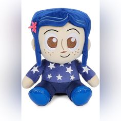 a small stuffed doll with blue hair and stars on it's body, sitting in front of a white background