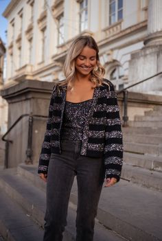 Black and silvery striped long sleeve cardigan that has glitter in the fabric and will have you glistening all day and night long! This cardigan is perfect way to 'spice' up your typical wardrobe collection for Fall and Winter! Our model wears the Grey Baptiste Jeans and the Black Glittery Vincent Top ONE SIZE (fits from US 2-4-6-8) Length 19.29 in - Width 21.65 in Contextures: 40% acrylic - 30% polyamide - 25% polyester - 5% wool Washing: handwash Glamorous Evening Cardigan For Winter, Glamorous Fall Sweater For Night Out, Glamorous Evening Winter Cardigan, Glamorous Winter Sweater For Night Out, Glamorous Winter Cardigan For Night Out, Sequin Winter Cardigan For Night Out, Black Fine Knit Winter Cardigan, Glamorous Sequin Winter Cardigan, Black Fuzzy Cardigan