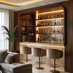 a living room filled with furniture and a bar