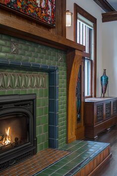 a living room with a fire place next to a window