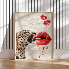 a leopard with red lips and lipstick on it's face next to a poster