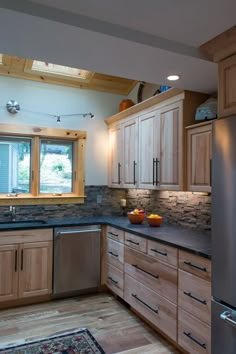 a kitchen with wooden cabinets and stainless steel appliances