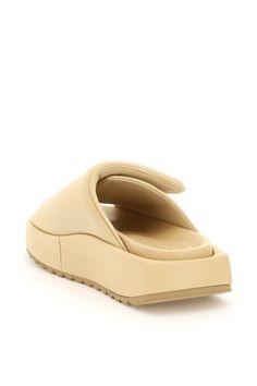 Gia 1 slides by GIABORGHINI characterized by the oversized padded band with velcro closure and leather piping and by the leather-coated flatform base. Leather moulded insole, serrated rubber tread. Composition: 60% poliestere, 32% nylon, 8% elastane, 100% pelle | GIA BORGHINI Women's Gia 1 Flatform Slides in Yellow | SS22 Gia Borghini, Butter Yellow, Coffee Brown, Leather Coat, Piping, Sneakers Fashion, Sunglasses Case, Shoes Flats, Slides