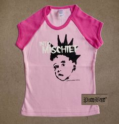 Into Mischief pink short sleeve tee with neon pink neck and raglan sleeves  -Inspired by The Misfits -Available in 2T or 4T -This style is fitted Our teensy styles are all hand printed on American made goods, in Los Angeles, with original Punk Baby® designs.   Shipping:  2-3 items (depending on size) will cost the same to ship within the US and internationally.  For international shipments, please allow more time to ship and to calculate shipping. Unisex Pink T-shirt With Screen Print, Unisex Pink T-shirt With Band Merch, Pink Punk T-shirt For Summer, Unisex Pink Screen Print T-shirt, Unisex Pink Summer Tops, Pink Unisex Tops For Spring, Unisex Pink T-shirt For Spring, Pink T-shirt For Spring, Unisex Pink Playful T-shirt