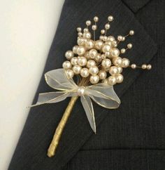 a boutonniere is adorned with pearls