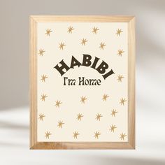 a wooden frame with the words habi i'm home on it