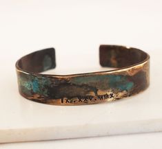 "Our bronze cuff is hand forged from rich jewelers bronze. Cuffs are hammered for texture and then aged in an organic solution to give it a verdigris patina. The aging process creates a different, unique patina on each piece. No two bracelets are exactly alike. A true one of a kind just like you. The Date of your choice is hand stamped into the bracelet. Bronze is the traditional gift for the 8th and 19th anniversary. *SIZING* The circumference of each cuff is the size in inches plus a 1.25\" to 19th Anniversary Gifts, Roman Numerals Dates, Date Bracelet, Roman Numeral Bracelet, 19th Anniversary, 8th Anniversary, Anniversary Gift For Him, Roman Numeral, Anniversary Gifts For Him