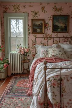 a bedroom with pink walls and floral wallpaper