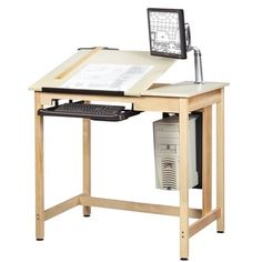 a wooden desk with a computer monitor and keyboard on it's top, sitting in front of a white background