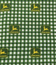 green and white gingham fabric with yellow deers on the front, and john deer