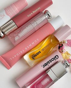 Pink Lip Balm Aesthetic, Lipstick And Gloss Combo, Lip Glosses Aesthetic, Pink Lip Products, Lip Oils Aesthetic, Cute Lip Gloss Aesthetic, Trending Beauty Products, Glossier Lip Balm Aesthetic, Lip Balms Aesthetic