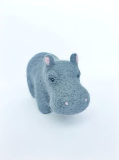 a stuffed hippo is shown in the snow