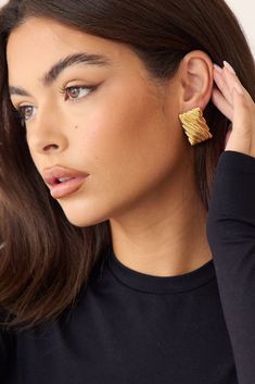 The Emery Earring is a versatile and stylish earring that can effortlessly elevate any outfit. Its bold texture and lightweight design make it comfortable to wear from day to night. Add a touch of elegance to your look with the Emery Earring. 16K Gold Filled lightweight Hypoallergenic Posts Height 3cm x Width 2cm Elegant Textured Formal Earrings, Modern Textured Gold Earrings, Modern Textured Drop Earrings, Everyday Gold-tone Tarnish Resistant Earrings, Chic Textured Gold Earrings, Chic Gold-tone Tarnish Resistant Earrings, Gold-tone Tarnish Resistant Dangle Earrings, Elegant Textured Gold Plated Earrings, Luxury Gold-tone Metal Earrings