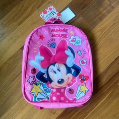 This Minnie Mouse Backpack Is The Perfect Size For Toddlers And Young Children. It Features Fully Adjustable Shoulder Straps To Provide Your Gild With The Perfect Fit And Also A Loop Carry Handle Pf/Sf Home See Minnie Mouse Lunchbox For Bundling! Minnie Mouse Standard Backpack For School, Minnie Mouse Standard School Backpack, Back To School Minnie Mouse Backpack, Back To School Minnie Mouse Standard Backpack, Disney Mickey Mouse Backpack For School, Disney Minnie Mouse Standard Backpack, Disney Minnie Mouse Backpack, School Backpack With Minnie Mouse Design, Disney Minnie Mouse Back To School Bag