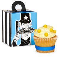 a cupcake next to a box with a cartoon character on it