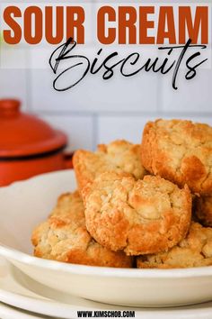 a white bowl filled with biscuits on top of a table