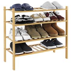 four tier shoe rack with multiple pairs of shoes on top and one pair of slippers on the bottom