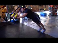 a man doing push ups in a gym