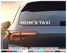 a car with the word mom's taxi written on it is shown in white