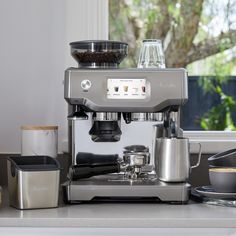 an espresso machine sitting on top of a counter